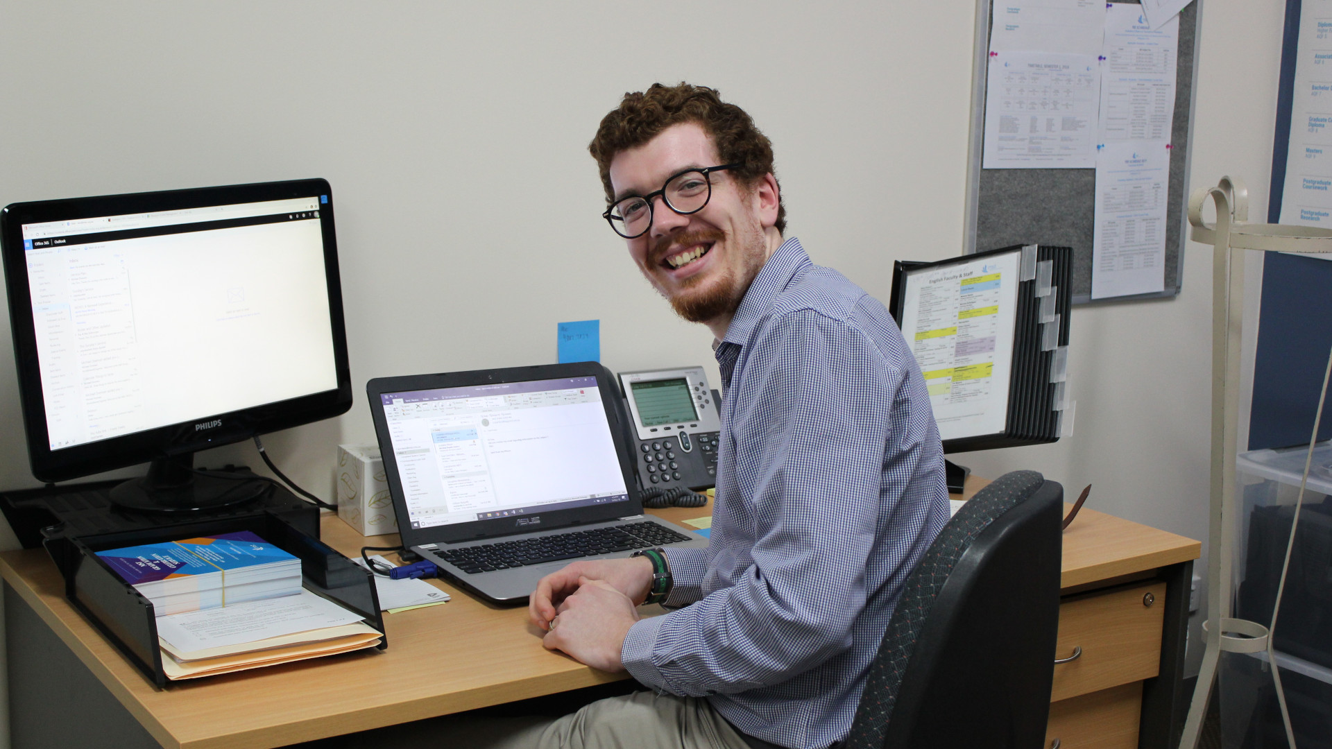 Tom Prowse sitting in his office at a desk